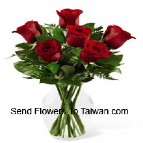 6 Red Roses With Some Ferns In A Glass Vase
