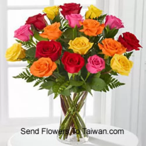 18 Mixed Colored Roses With Seasonal Fillers In A Glass Vase
