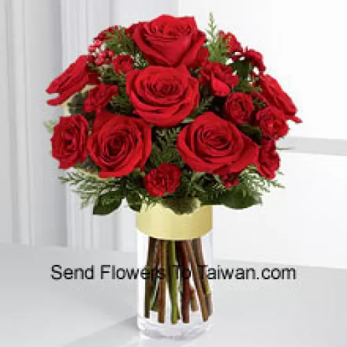 Send them the warmth and heartfelt sentiments expressed throughout the holiday season. Rich red roses and spray roses are offset by burgundy mini carnations, variegated holly stems and assorted holiday greens, beautifully arranged in a clear glass gold banded vase to bring your special recipient a merry moment they will treasure throughout the Chinese New Year season. (Please Note That We Reserve The Right To Substitute Any Product With A Suitable Product Of Equal Value In Case Of Non-Availability Of A Certain Product)
