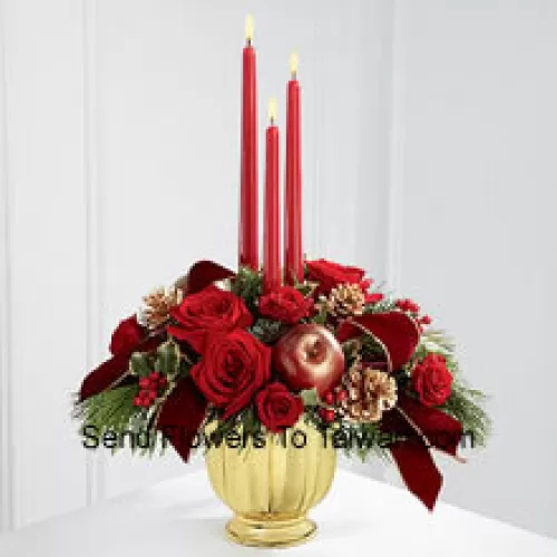 The grandeur and rich beauty of the Chinese New Year season are highlighted with each crimson bloom. Bright red roses and spray roses are arranged in a designer gold container amongst variegated holly and assorted holiday greens. Accented with artificial apples, gold pinecones and gold-edged burgundy ribbon, this gorgeous centerpiece displays three red taper candles to create the perfect atmosphere for their holiday celebration.  (Please Note That We Reserve The Right To Substitute Any Product With A Suitable Product Of Equal Value In Case Of Non-Availability Of A Certain Product)